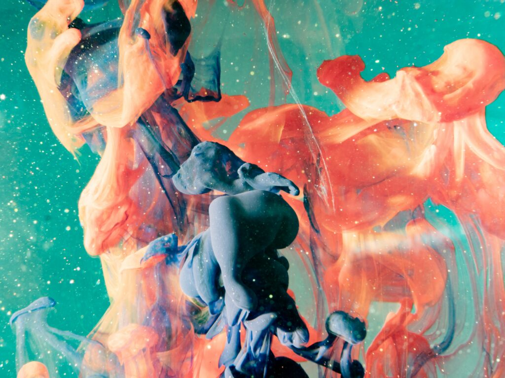 Vibrant Abstract Wallpaper: Swirling Inks and Cosmic Colors