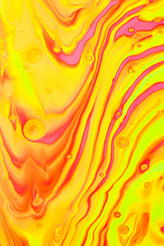 Dynamic Yellow Abstract Wallpaper with Fluid Paint Swirls
