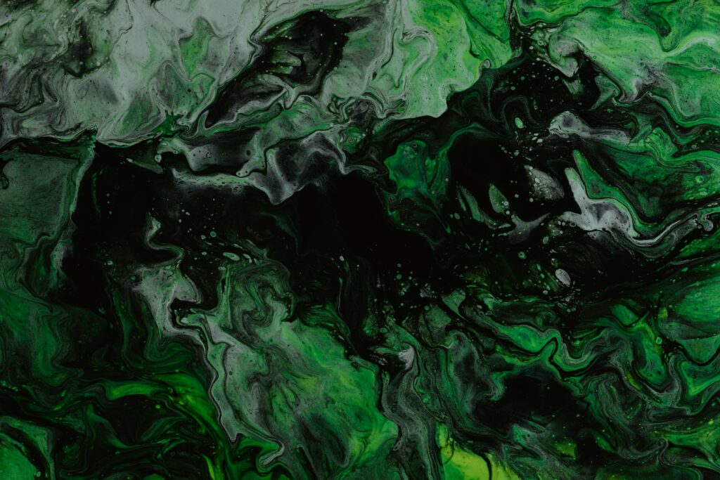 Vibrant Abstract Liquid Wallpaper in Green with Black Stains Background