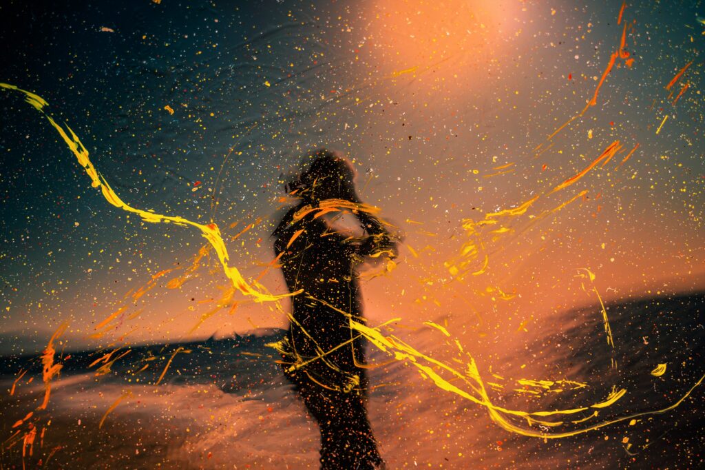 Dynamic Abstract Wallpaper: Man Silhouette with Colorful Splash
