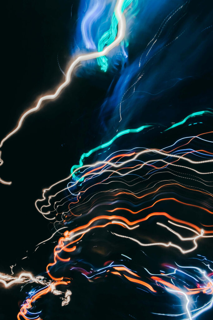 Vibrant Abstract Neon Light Streaks - Dynamic Dark Background Wallpaper