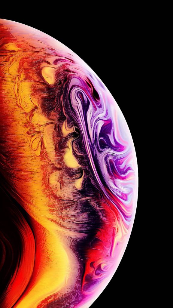 Colorful abstract planet sphere wallpaper with vibrant red orange purple on black background