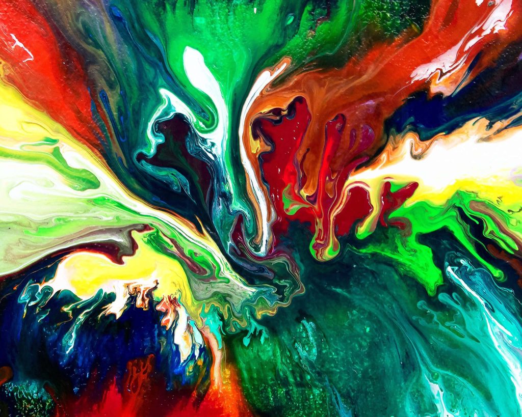Abstract swirl wallpaper with vivid green red and yellow liquid acrylic pour for vibrant screens