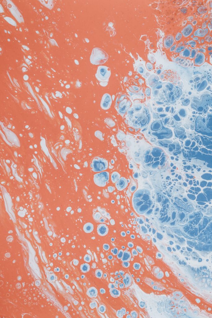 Vibrant Coral Background with Blue & White Abstract Bubble Wallpaper