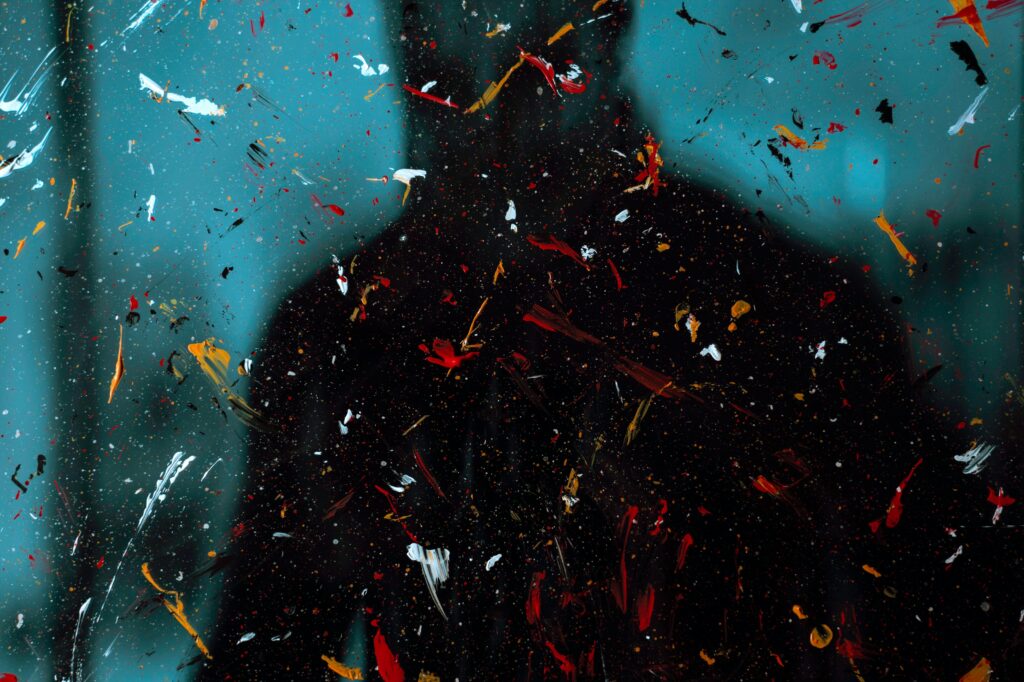 Vibrant Abstract Wallpaper: Blurred Silhouette & Paint Splashes
