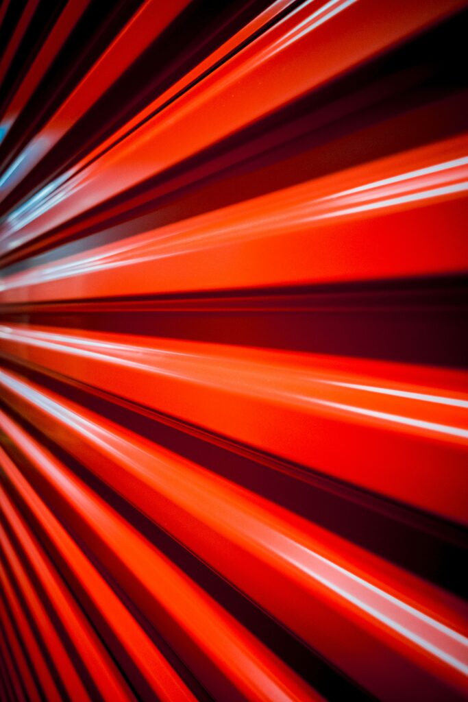 Bold Red Abstract Wallpaper with Dynamic Light and Shadow Effects