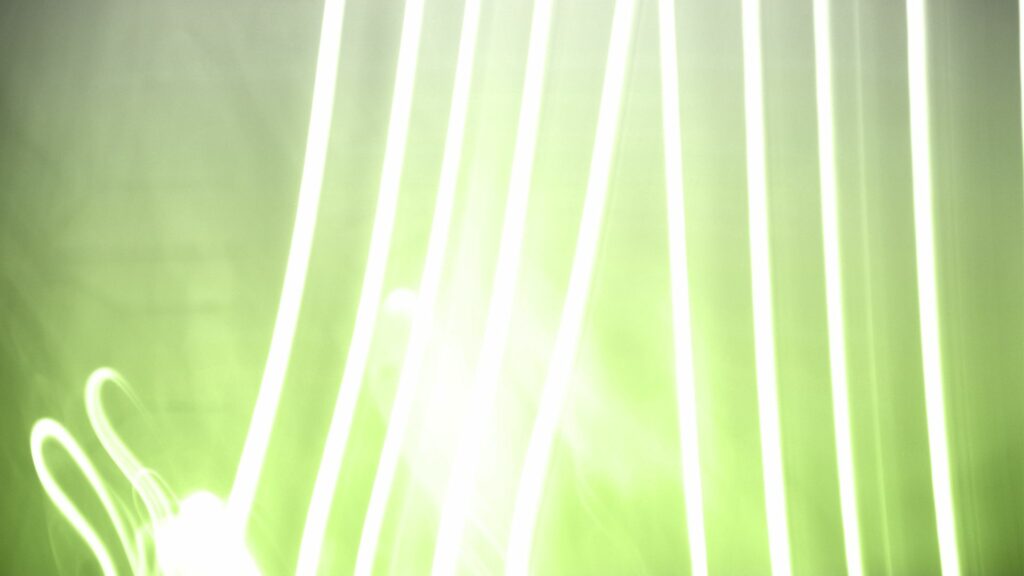 Vibrant Abstract Wallpaper with Vertical Light Lines on Greenish-Yellow