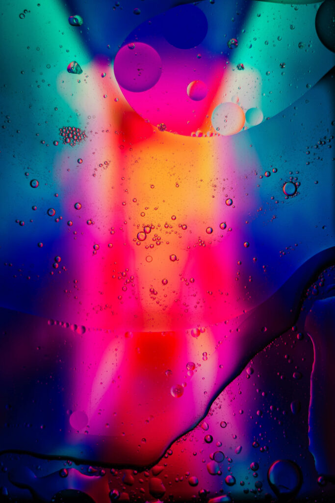 Vibrant Abstract Wallpaper: Neon Droplets on Dark Background