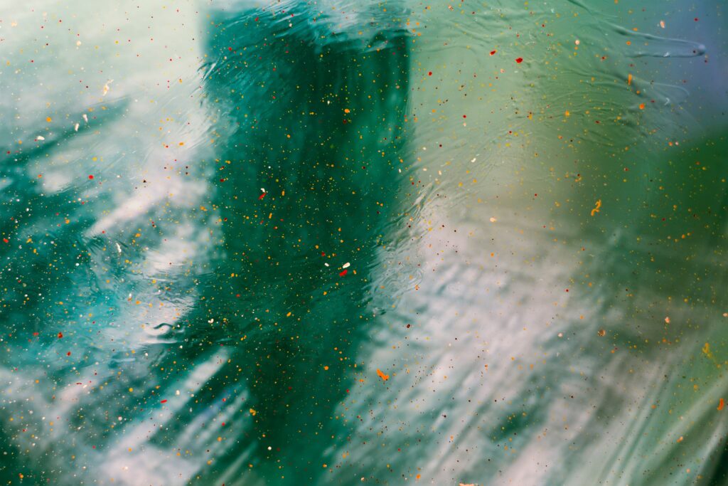 Vibrant Abstract Wallpaper: Colorful Paint Splatters on Glass Background