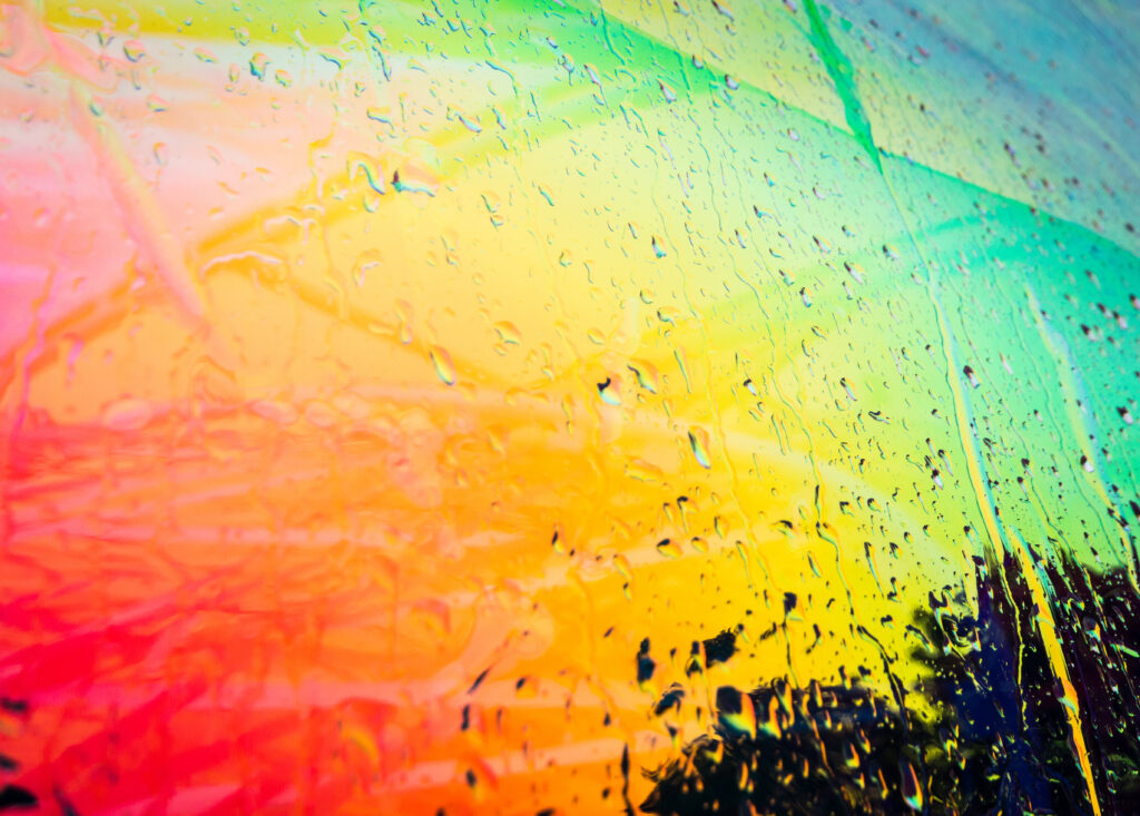 Vibrant Abstract Wallpaper with Colorful Patterns and Water Droplets