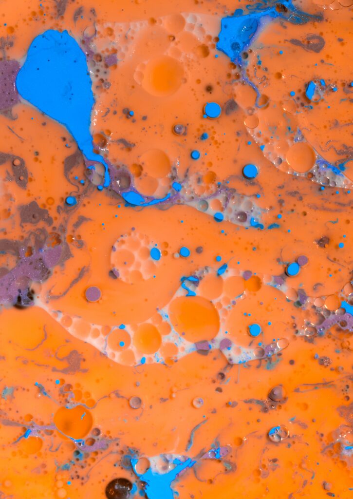 Vibrant Abstract Wallpaper: Fluid Orange and Blue Paint Stains
