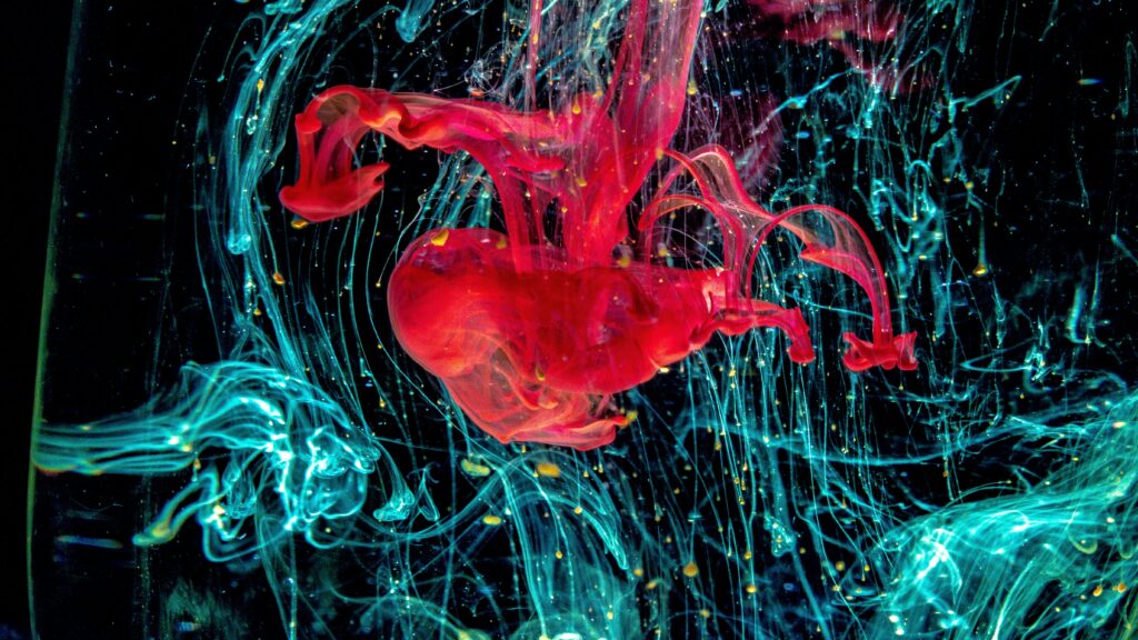 Vivid Abstract Wallpaper: Red & Turquoise Paint Swirls on Dark Background