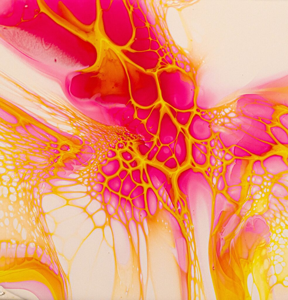 Vibrant Pink & Yellow Abstract Fluid Wallpaper with Dynamic Patterns