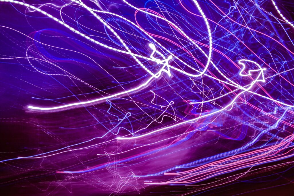 Dynamic Abstract Wallpaper: Bright Wavy Lines on Dark Background