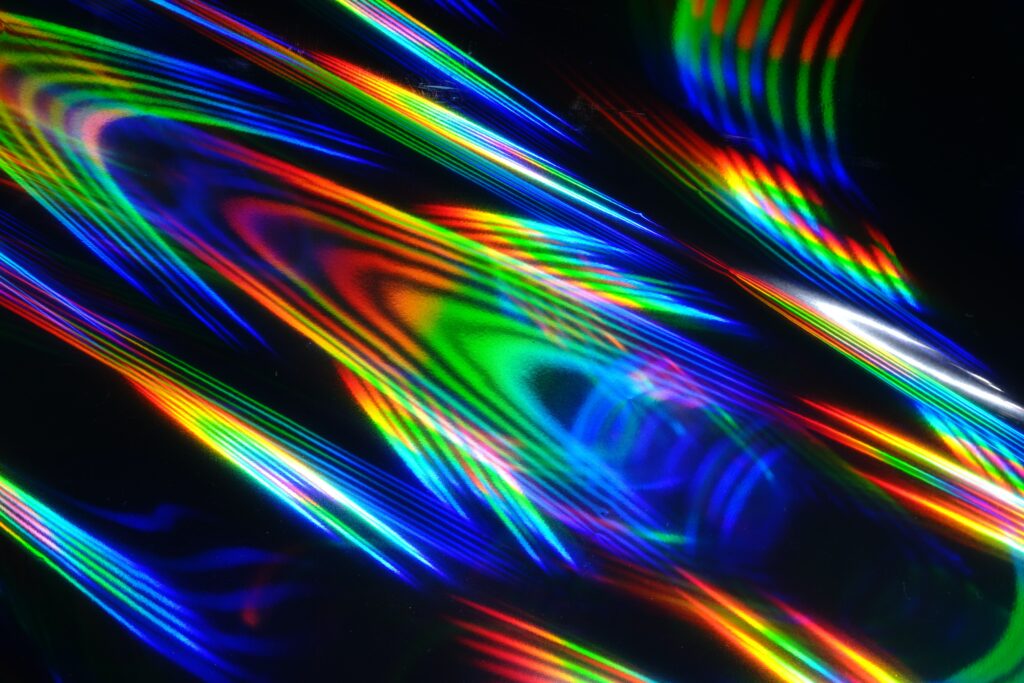 Vibrant Abstract Wallpaper: Colorful Iridescent Rays on Dark Background