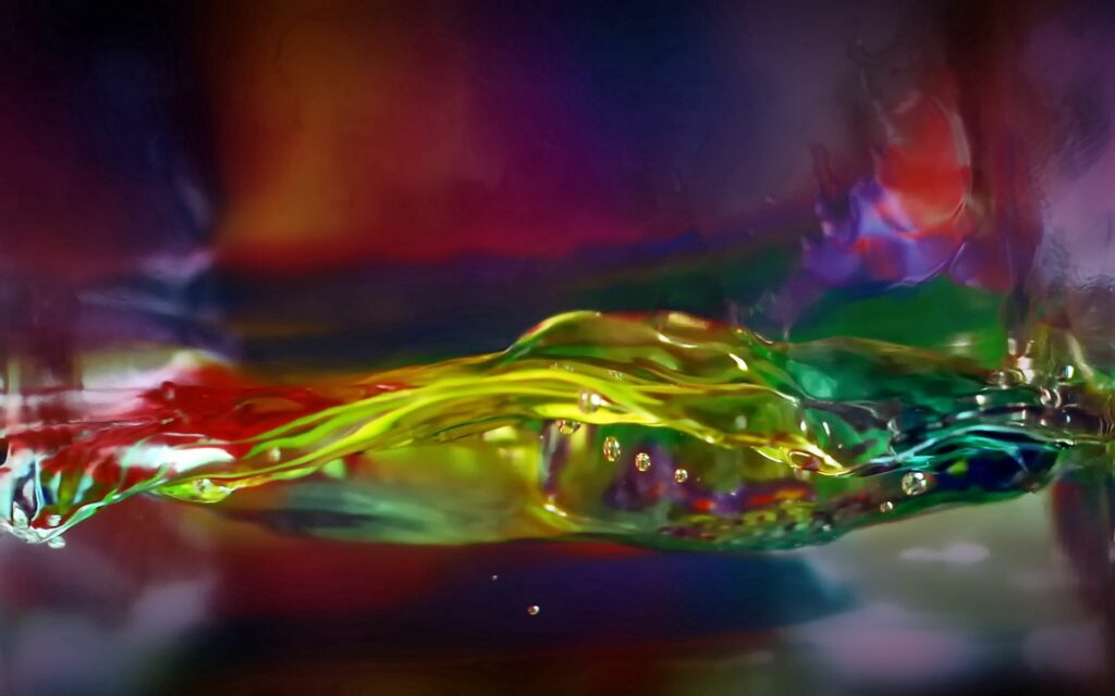 Dynamic Yellow, Red, & Blue Liquid Flow Abstract Wallpaper Background