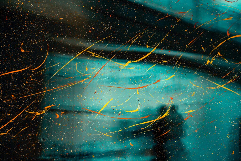 Vibrant Abstract Wallpaper: Paint Streaks on Glass Surface Background