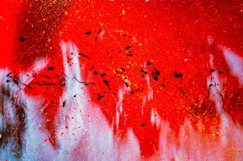Vibrant Abstract Wallpaper with Red Paint Splatters on Glass