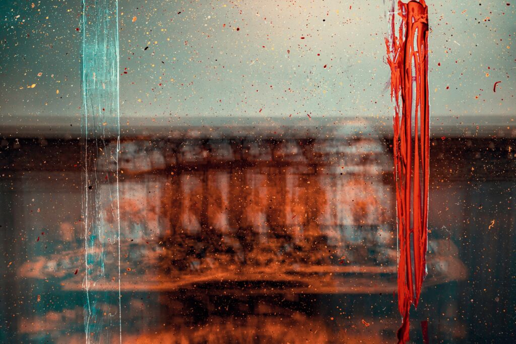 Vibrant Abstract Wallpaper with Red Paint Streaks and Intricate Textures