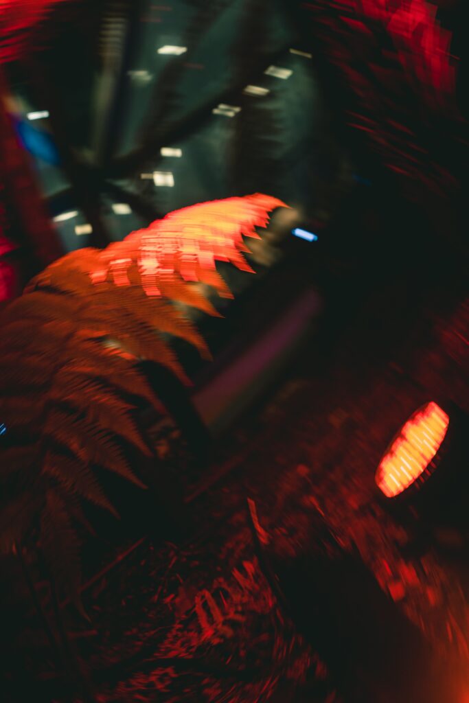 Dynamic Abstract Wallpaper: Swirling Motion Blur with Bright Orange Light