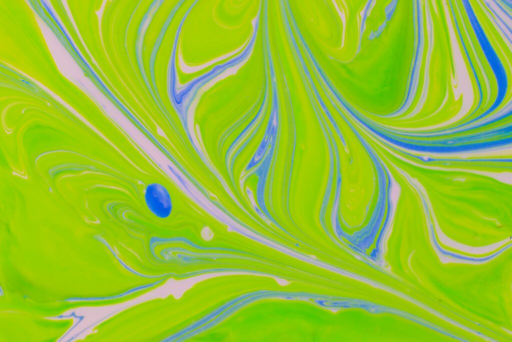Vibrant Abstract Wallpaper: Fluid Green, White, and Blue Design Background