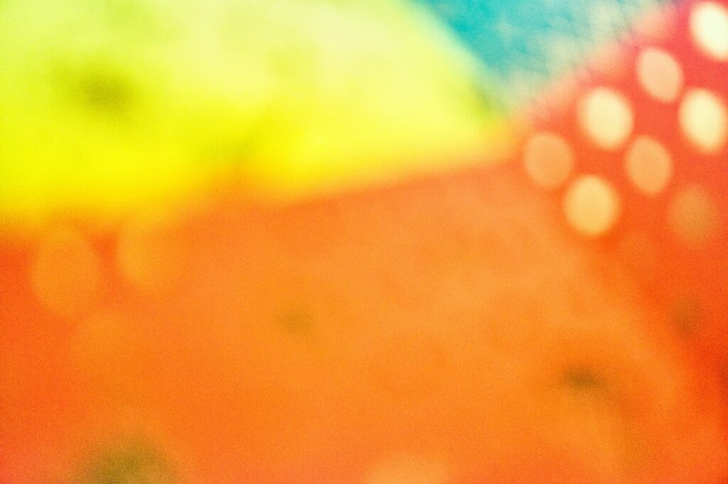 Vibrant Abstract Background: Blurred Colors in Yellow, Orange & Green Wallpaper