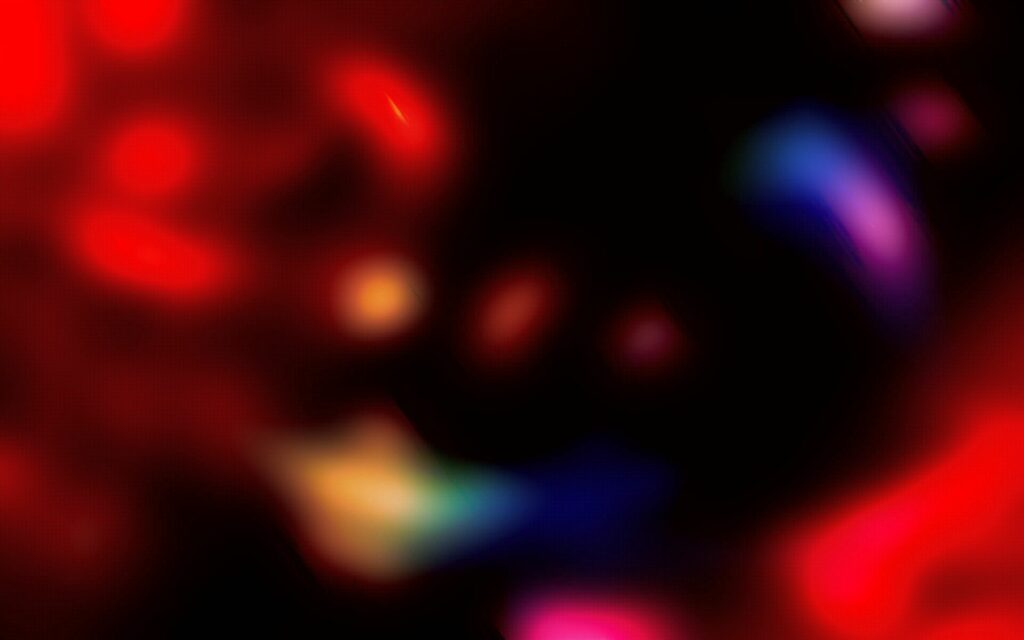 Vibrant Abstract Wallpaper: Colorful Blurred Lights on Dark Background