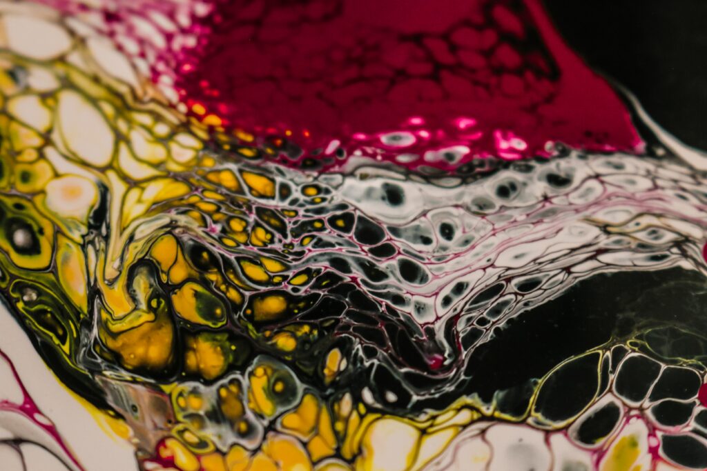Vibrant Abstract Wallpaper: Swirling Liquid Paint Patterns in Bold Colors