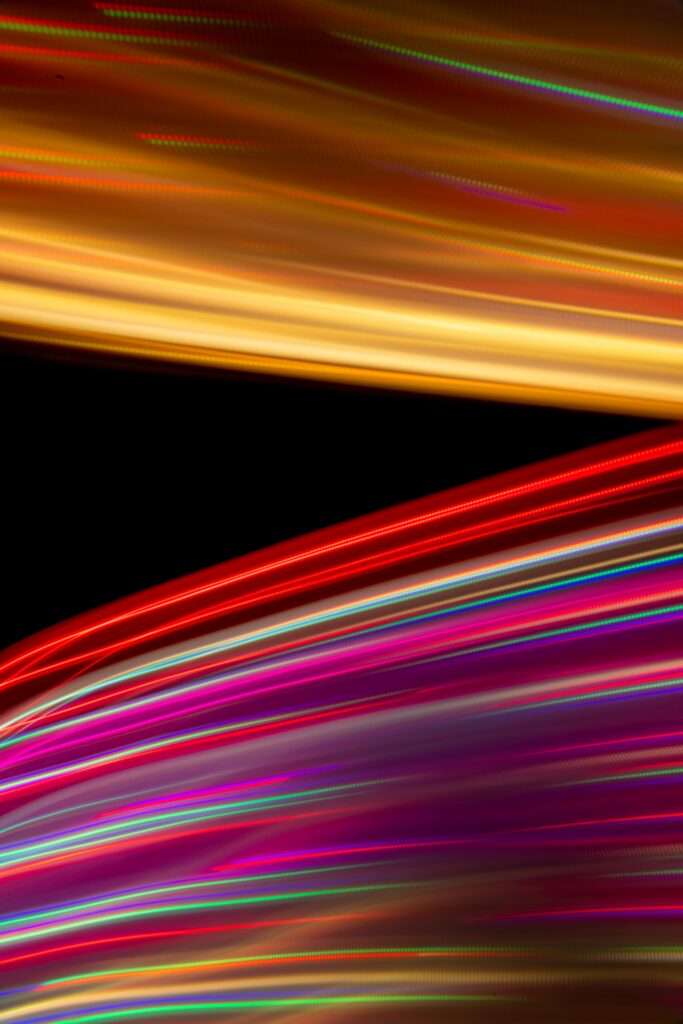 Vibrant Abstract Wallpaper: Colorful Blurred Lines on Dark Background