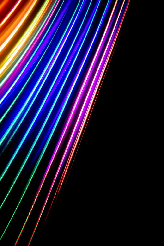 Dynamic Colorful Abstract Wallpaper with Vibrant Lines on Dark Background