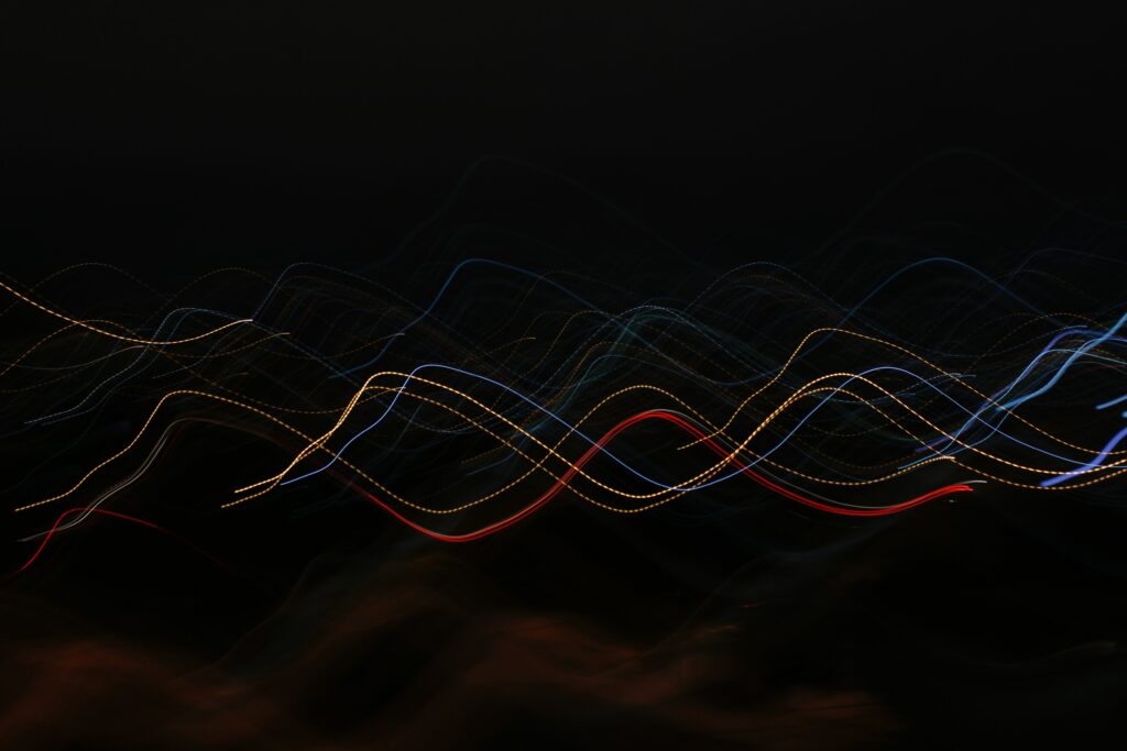 Abstract Colorful Wavy Lines Wallpaper on Dark Background - High Res