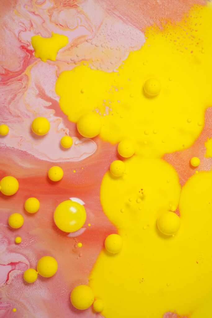 Mesmerizing Abstract Yellow Bubbles on Pink and Red Background Wallpaper