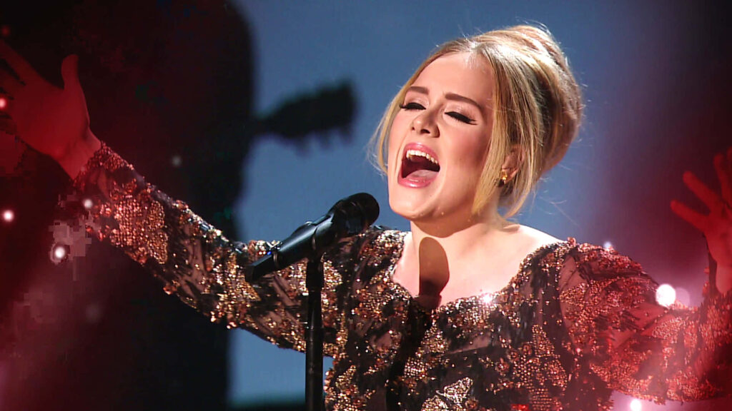 Vibrant Adele Wallpaper: Passionate Performance in Sequined Glam