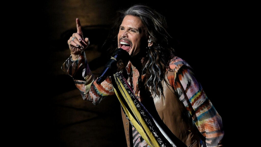Vibrant Aerosmith Wallpaper: Steven Tyler Live in Concert Background