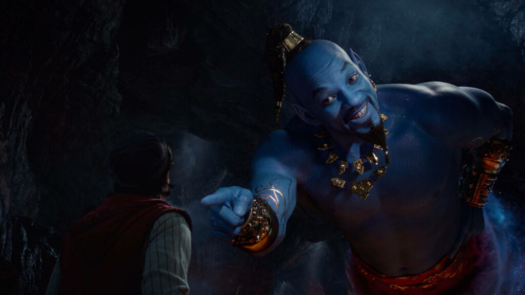 Vibrant Genie Wallpaper: Live-Action Aladdin in a Mystical Cave