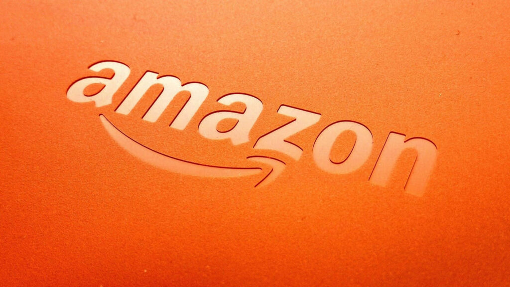 Vibrant Amazon UK Logo stands out in Orange Backdrop Wallpaper