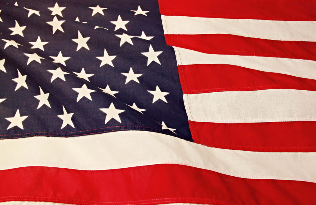 Vibrant American Flag Wallpaper: Dynamic Red, White, and Blue Waves