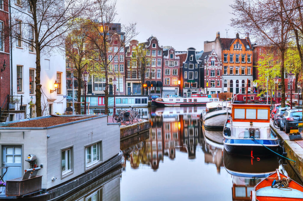 Colorful Amsterdam Canal View - Serene Wallpaper Background
