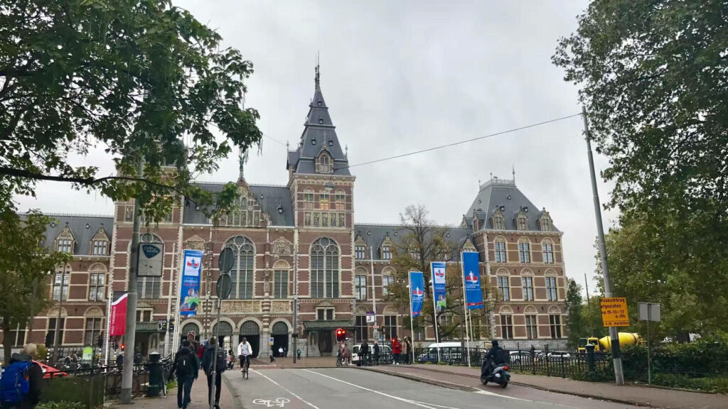 Vibrant Amsterdam Street Scene Near Rijksmuseum - Wallpaper Background