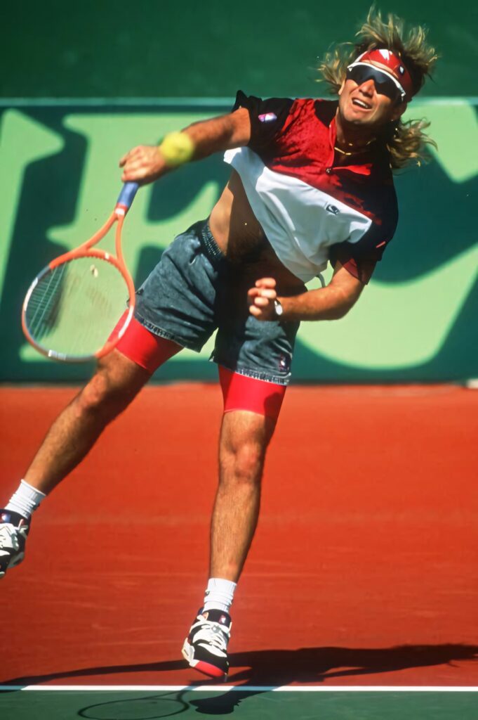 Vibrant Andre Agassi Wallpaper: Iconic Jump Shot in Dynamic Action
