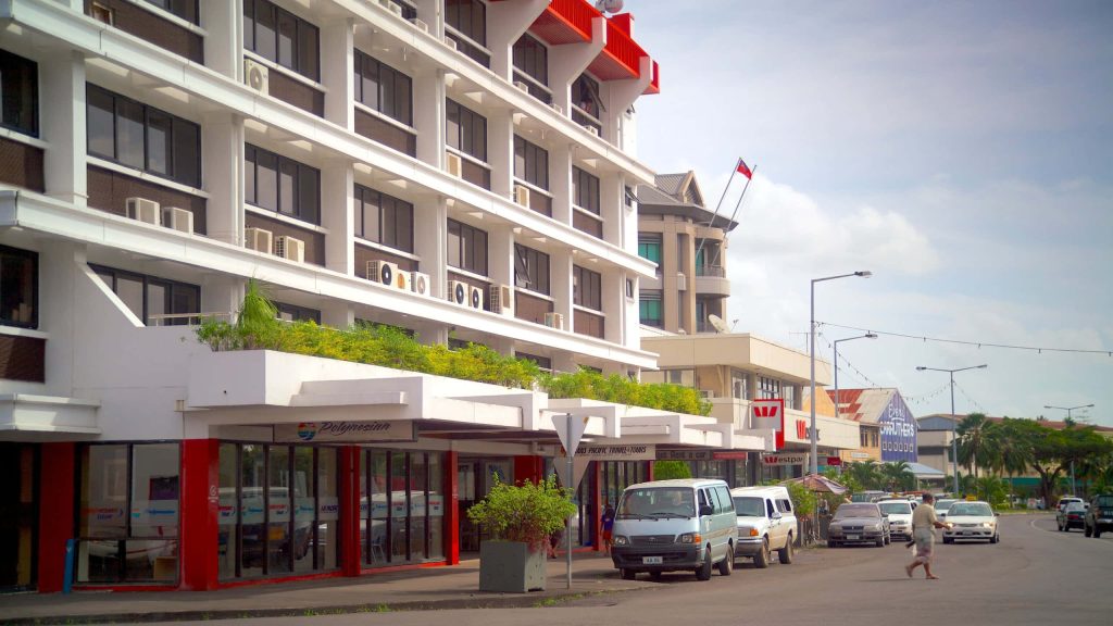 Vibrant street view of Apia Beachfront with local shops and Westpac bank in bright daylight Wallpaper
