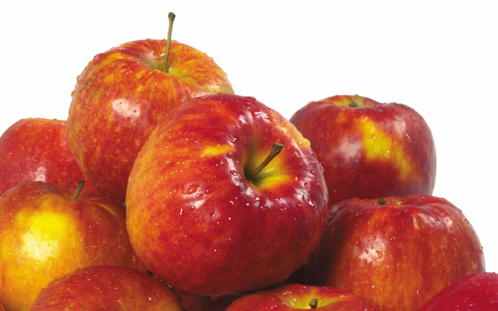 Vibrant Wallpaper of Glistening Red Apples on Plain Background