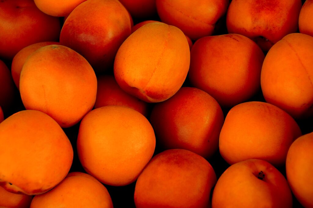 Vibrant Apricot Wallpaper: Close-Up of Ripe Fresh Fruit Background