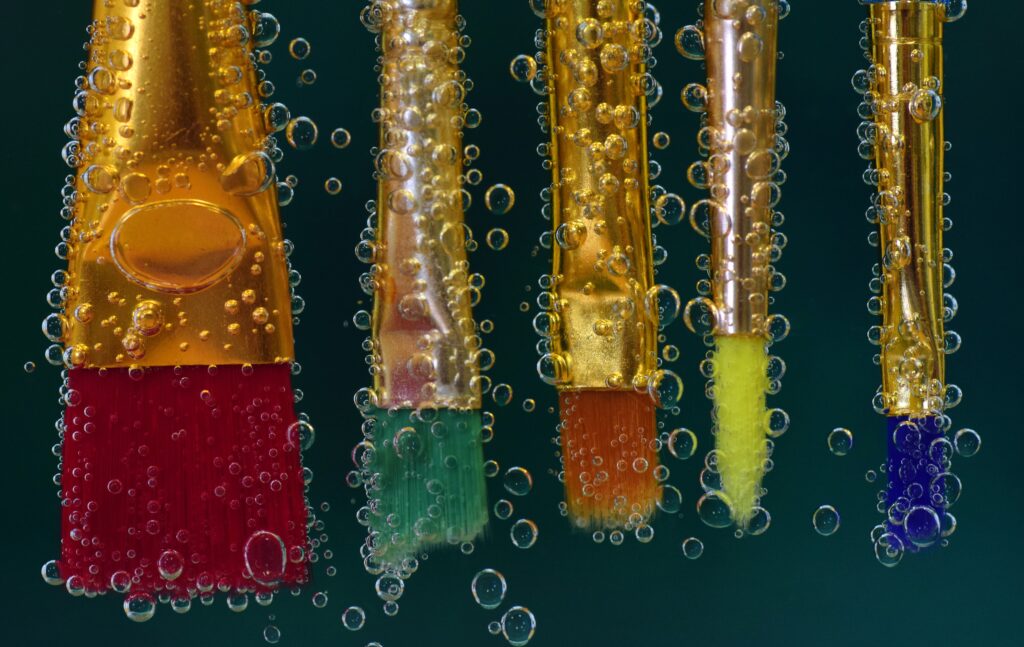 Vibrant Artistic Wallpaper with Colorful Paintbrushes & Bubbles