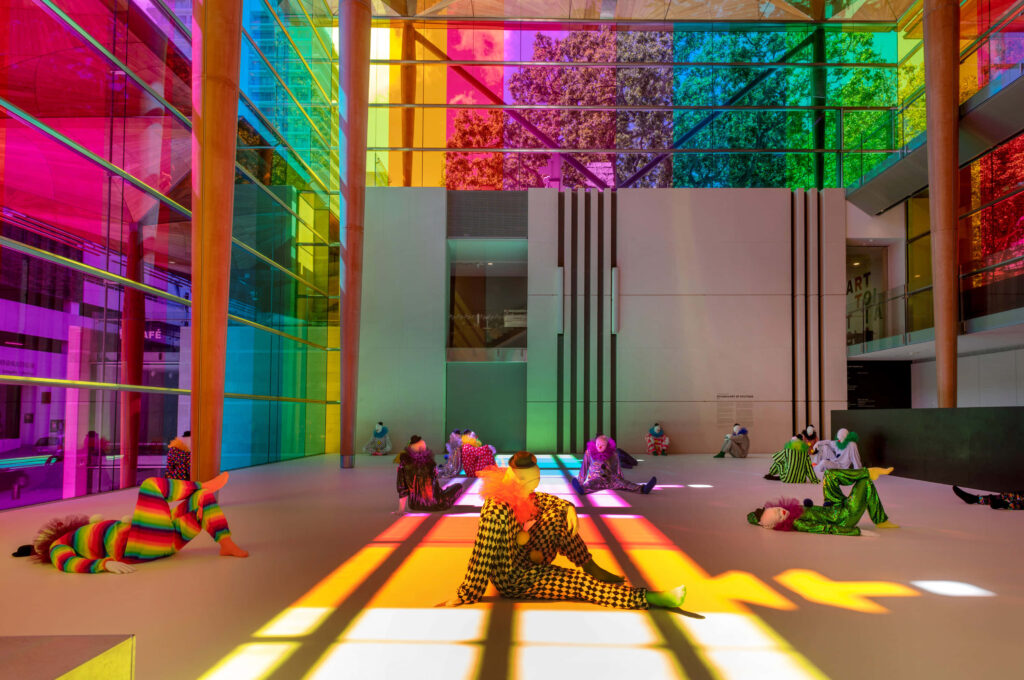 Auckland Art Gallery interior with rainbow light streaming through glass windows creating colorful patterns Wallpaper