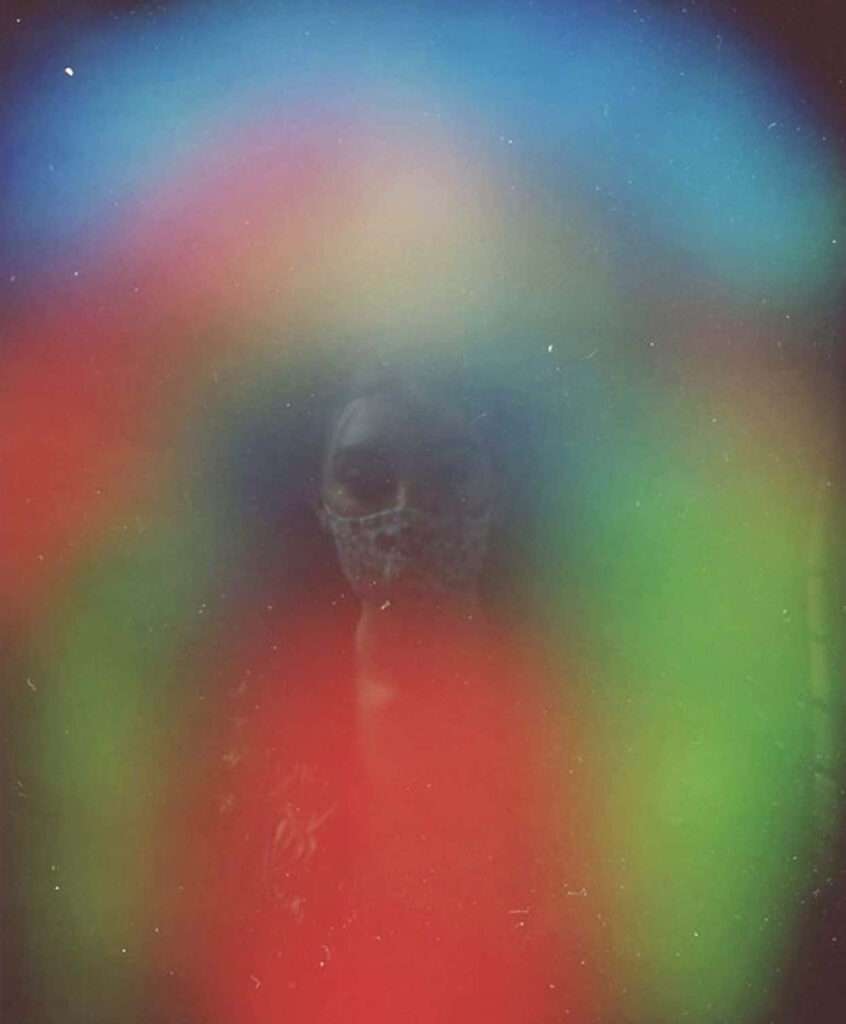 Vibrant Aura Wallpaper: Radiant Colors from Central Human Figure