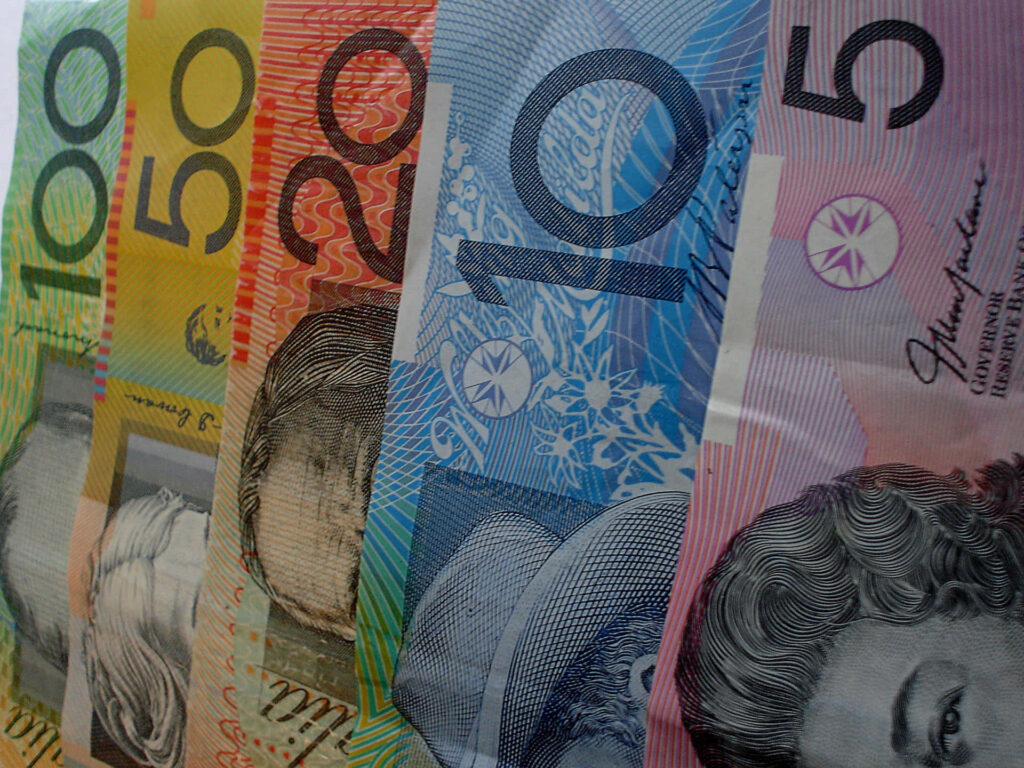 Close-up of colorful Australian dollar banknotes with detailed patterns vibrant wallpaper background