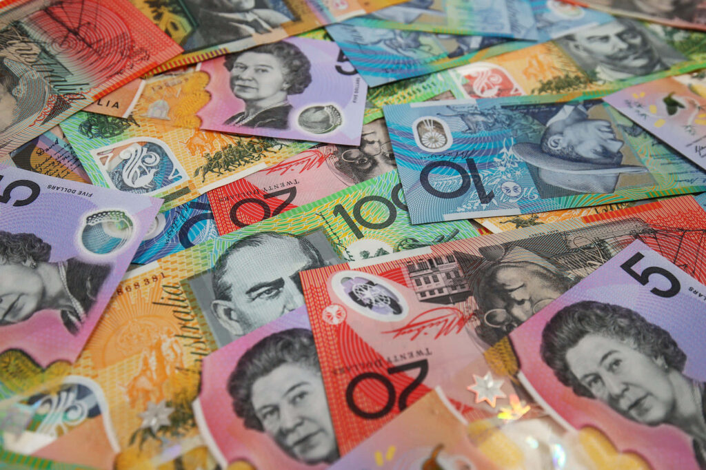 Vibrant Australian dollar banknotes collage with colorful designs and iconic portraits wallpaper