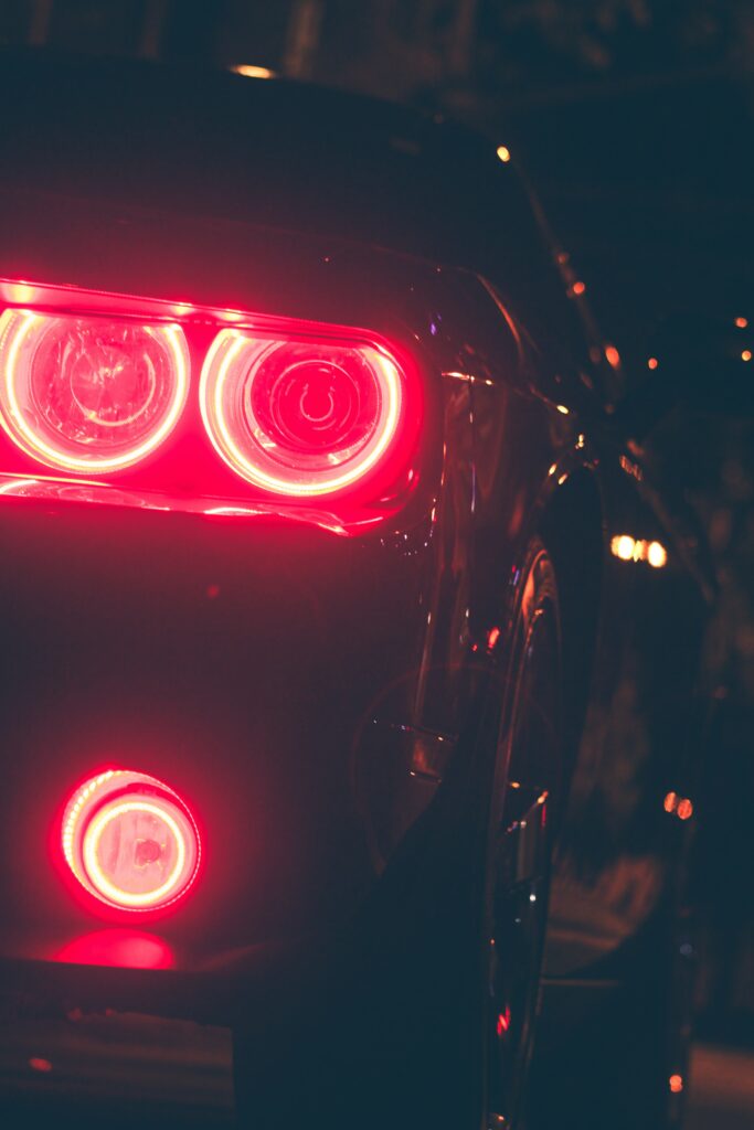 Vibrant Auto Rear Lights in a Dark Setting - Stunning Wallpaper