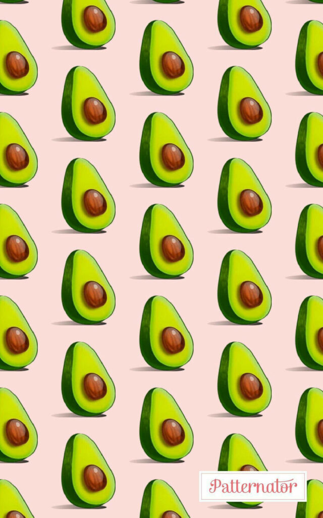 Vibrant Avocado Halves Wallpaper on Soft Pink Background - Playful Design
